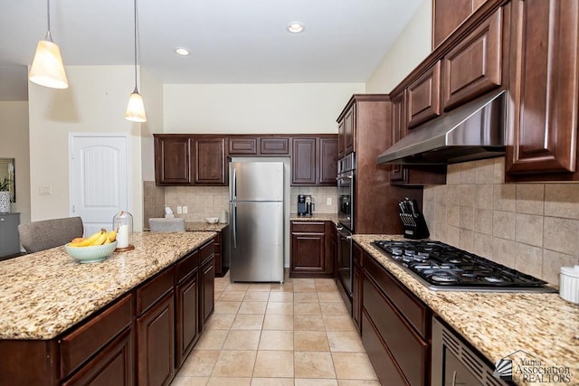 3674 W 39th St, Yuma, AZ 85365 - kitchen with light stone countertops, a center island, under cabinet range hood, backsplash, and stainless steel appliances