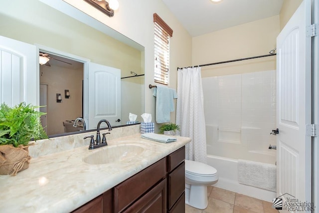 3674 W 39th St, Yuma, AZ 85365 - full bathroom featuring ceiling fan, tile patterned flooring, vanity, toilet, and shower / bath combo with shower curtain