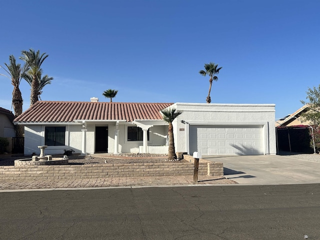 11651 E Via Salida, Yuma, AZ 85367 - mediterranean / spanish house with an attached garage, driveway, a tile roof, and stucco siding