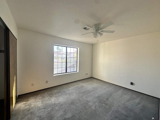 11651 E Via Salida, Yuma, AZ 85367 - unfurnished bedroom featuring baseboards, ceiling fan, and carpet