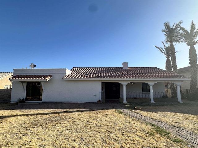 11651 E Via Salida, Yuma, AZ 85367 - mediterranean / spanish-style home with a chimney, stucco siding, and a tile roof