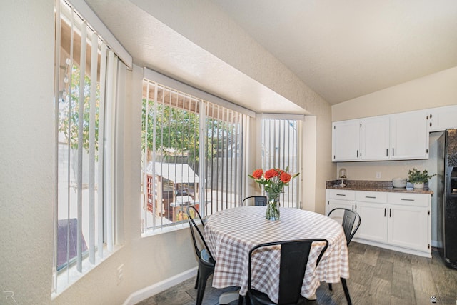 6340 E 45th Pl, Yuma, AZ 85365 - dining room with healthy amount of natural light, vaulted ceiling, wood finished floors, and baseboards
