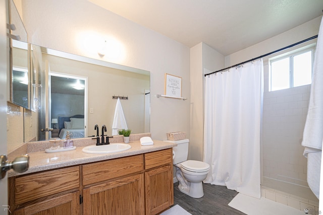 6340 E 45th Pl, Yuma, AZ 85365 - bathroom with vanity, toilet, wood finished floors, a shower with curtain, and ensuite bathroom