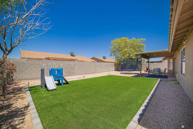 6340 E 45th Pl, Yuma, AZ 85365 - view of yard featuring a trampoline and a patio area