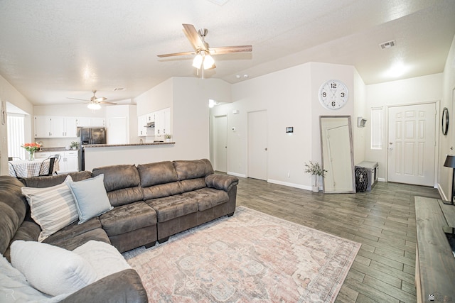 6340 E 45th Pl, Yuma, AZ 85365 - living area featuring a ceiling fan, lofted ceiling, wood finished floors, baseboards, and a textured ceiling