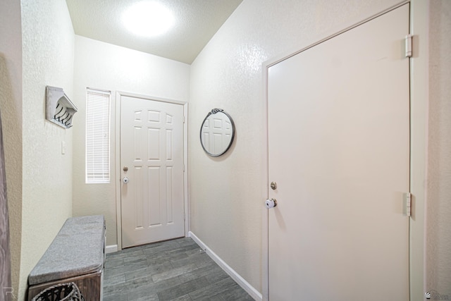 6340 E 45th Pl, Yuma, AZ 85365 - doorway to outside featuring dark wood finished floors and baseboards