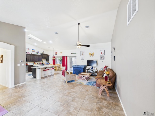 5936 E 39th St, Yuma, AZ 85365 - living area with lofted ceiling, ceiling fan, and baseboards
