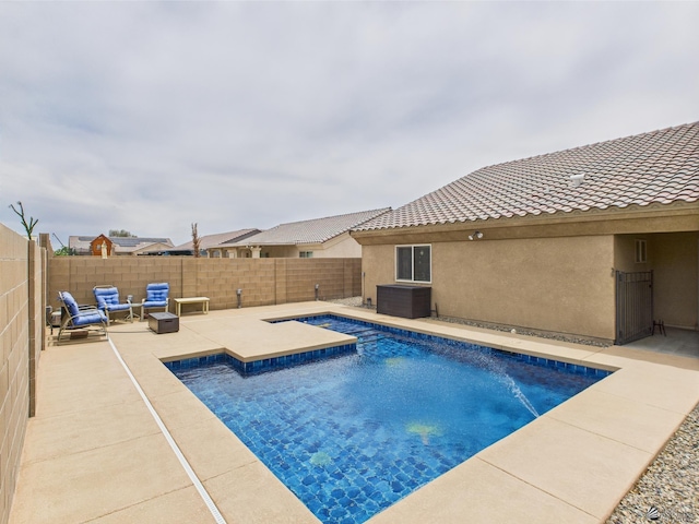 5936 E 39th St, Yuma, AZ 85365 - view of swimming pool with a fenced backyard, a patio area, a hot tub, and an outdoor hangout area
