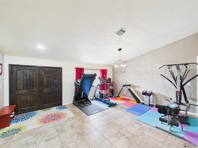 5936 E 39th St, Yuma, AZ 85365 - workout area featuring a textured ceiling, a chandelier, tile patterned flooring, and recessed lighting