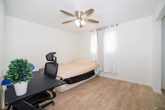 12687 E 42nd Pl, Yuma, AZ 85367 - bedroom featuring baseboards, a ceiling fan, and light wood-style flooring