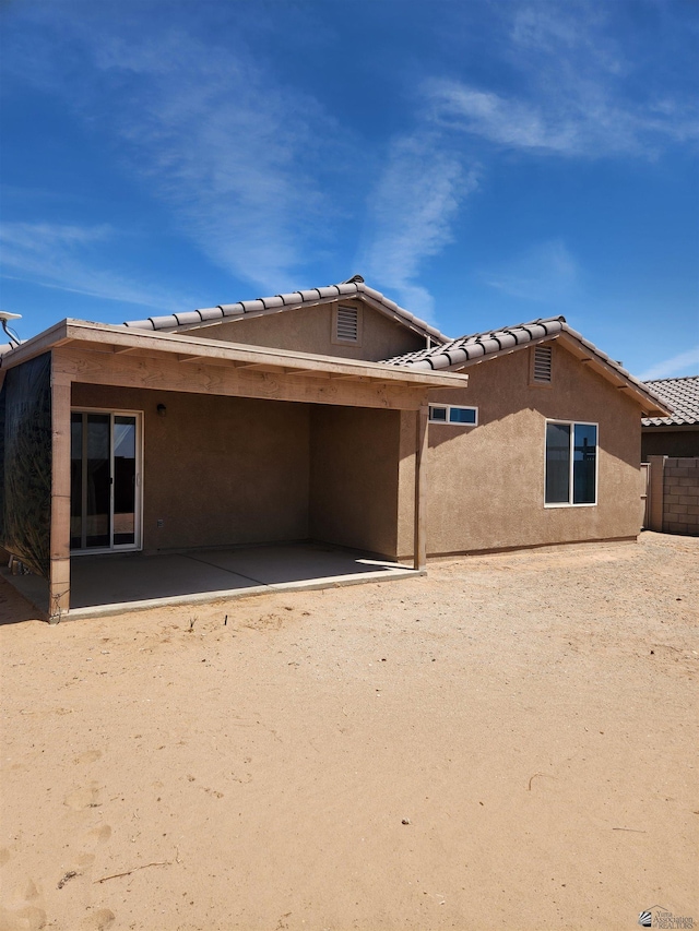 3708 S Desert Oasis Dr, Yuma, AZ 85365 - rear view of house with stucco siding, a patio area, and a tile roof