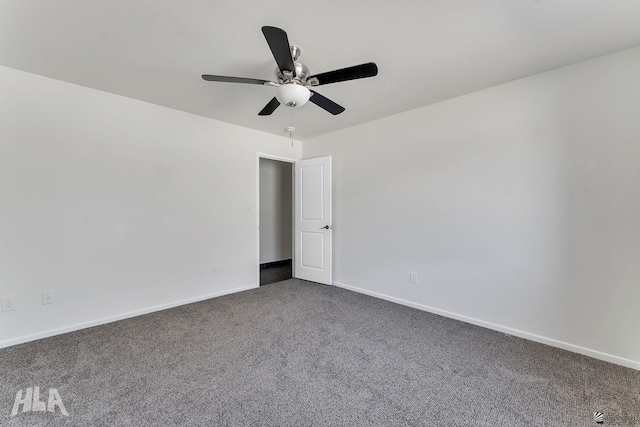 unfurnished room featuring ceiling fan, baseboards, and dark colored carpet