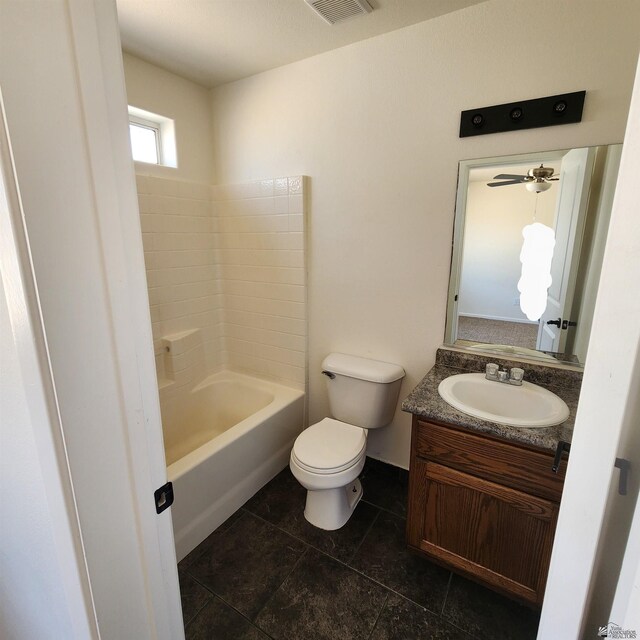 bathroom featuring vanity, toilet, baseboards, and visible vents