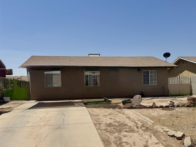 219 E Rio Sonora St, San Luis, AZ 85336 - back of house featuring stucco siding and a patio area