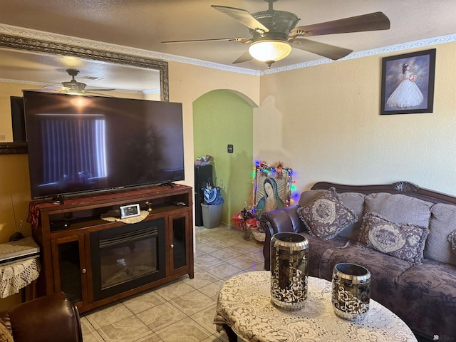 219 E Rio Sonora St, San Luis, AZ 85336 - living room with ceiling fan, light tile patterned flooring, ornamental molding, and arched walkways