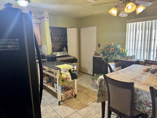 219 E Rio Sonora St, San Luis, AZ 85336 - bedroom with freestanding refrigerator, a textured ceiling, light tile patterned flooring, and a ceiling fan