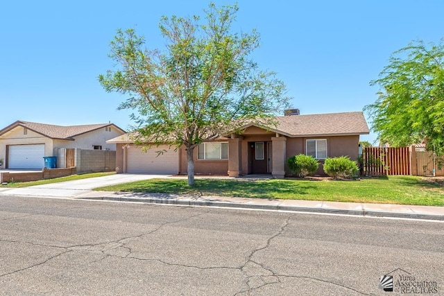 11279 E 26th Ln, Yuma, AZ 85367 - ranch-style house featuring an attached garage, concrete driveway, and stucco siding