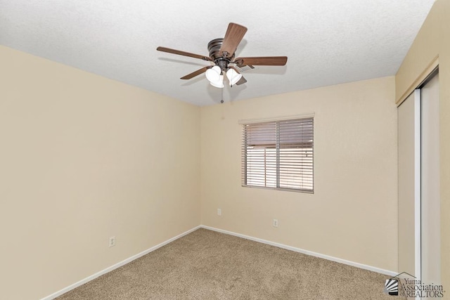 11279 E 26th Ln, Yuma, AZ 85367 - unfurnished bedroom featuring light carpet, a closet, ceiling fan, and a textured ceiling