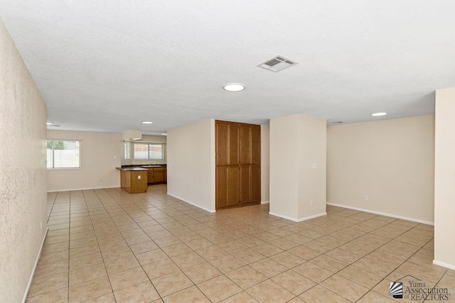 11279 E 26th Ln, Yuma, AZ 85367 - unfurnished living room featuring light tile patterned floors and recessed lighting