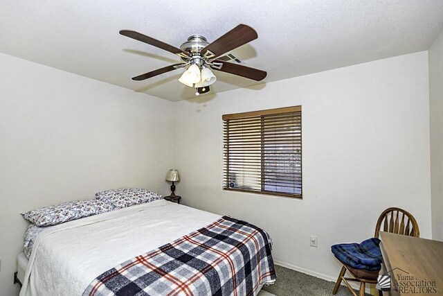 13405 E 54th St, Yuma, AZ 85367 - bedroom with carpet floors, baseboards, and ceiling fan