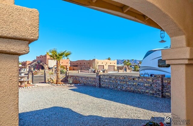 13405 E 54th St, Yuma, AZ 85367 - view of yard with fence, a gate, and a residential view