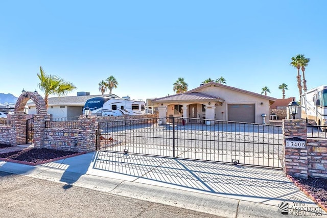 13405 E 54th St, Yuma, AZ 85367 - view of front facade featuring an attached garage, stucco siding, concrete driveway, and fence private yard