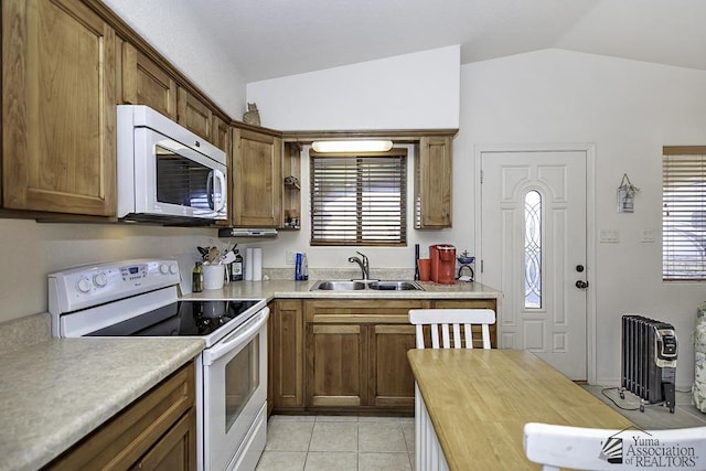 13405 E 54th St, Yuma, AZ 85367 - kitchen with a sink, vaulted ceiling, white appliances, and a healthy amount of sunlight