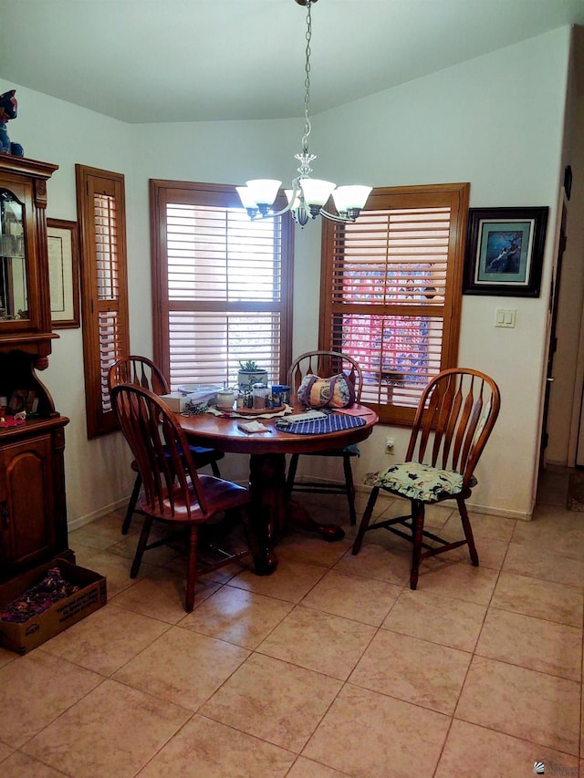 13375 E 52nd St, Yuma, AZ 85367 - dining area with a chandelier, light tile patterned floors, lofted ceiling, and baseboards