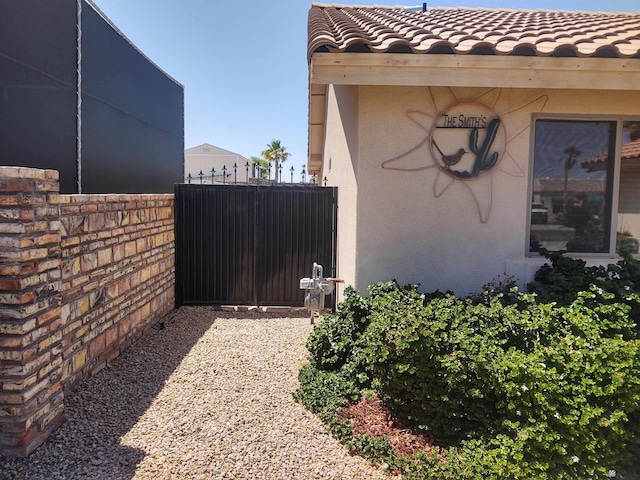 13375 E 52nd St, Yuma, AZ 85367 - view of home's exterior featuring stucco siding, fence, and a tile roof