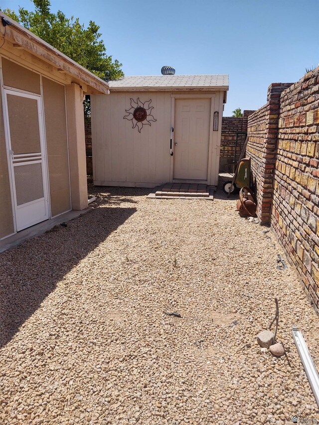 13375 E 52nd St, Yuma, AZ 85367 - view of yard featuring fence, an outbuilding, and a storage shed