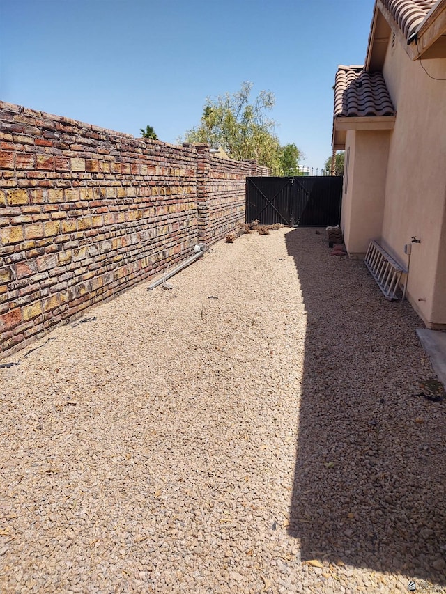 13375 E 52nd St, Yuma, AZ 85367 - view of yard with fence and a gate
