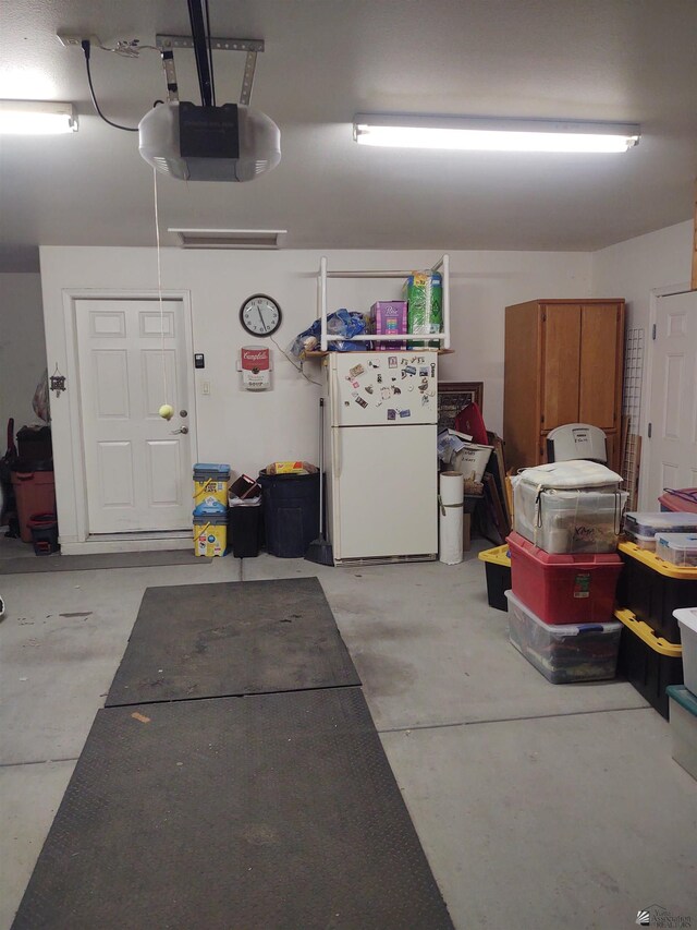 13375 E 52nd St, Yuma, AZ 85367 - garage featuring freestanding refrigerator and a garage door opener