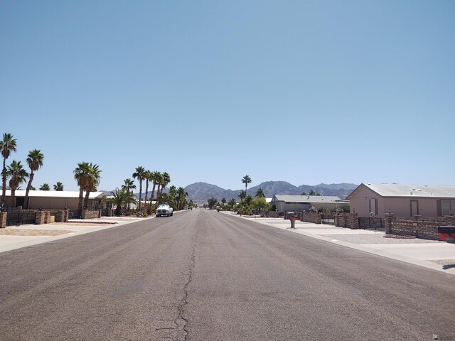 13375 E 52nd St, Yuma, AZ 85367 - view of asphalt street featuring a mountain view and sidewalks