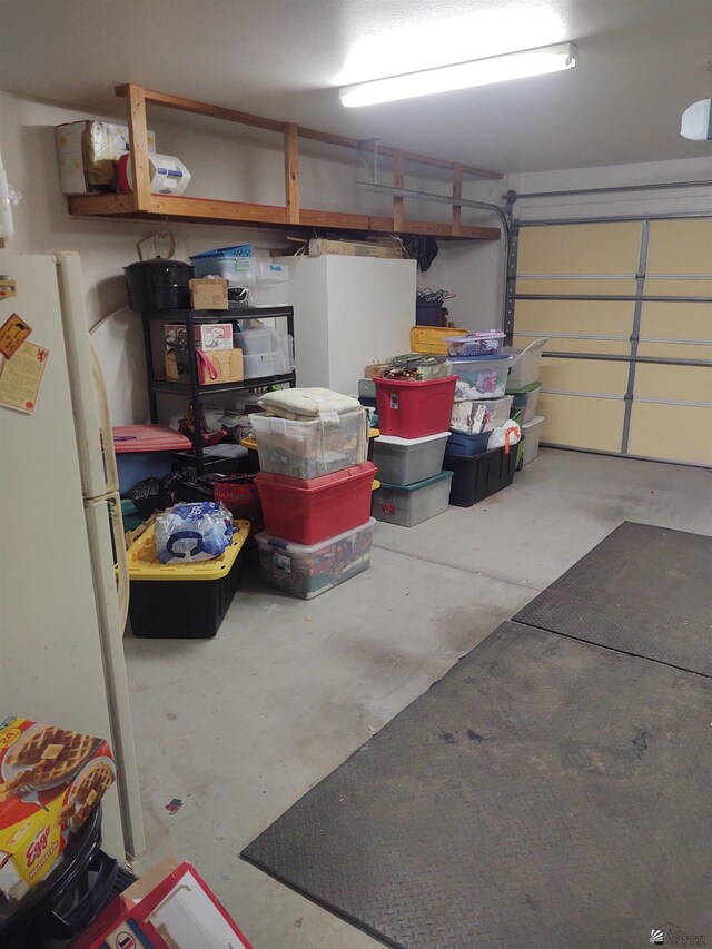 13375 E 52nd St, Yuma, AZ 85367 - garage with freestanding refrigerator and a garage door opener