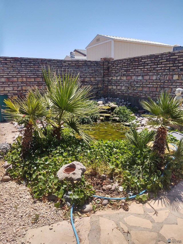 13375 E 52nd St, Yuma, AZ 85367 - view of yard featuring fence and a small pond