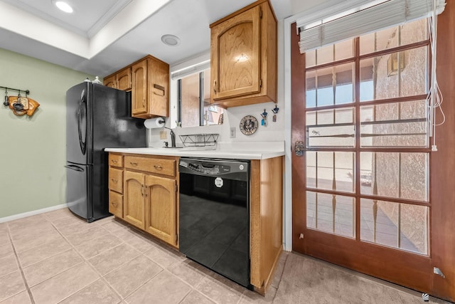 11230 E 37th Pl Unit 131, Yuma, AZ 85367 - kitchen featuring black appliances, light countertops, crown molding, brown cabinetry, and light tile patterned flooring