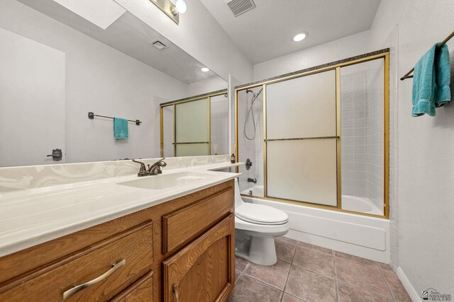 11230 E 37th Pl Unit 131, Yuma, AZ 85367 - bathroom with vanity, combined bath / shower with glass door, recessed lighting, and tile patterned floors