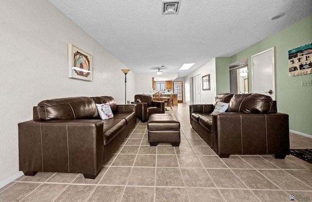 11230 E 37th Pl Unit 131, Yuma, AZ 85367 - tiled living area with a textured ceiling