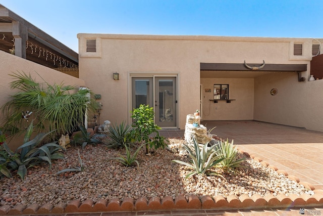 11230 E 37th Pl Unit 131, Yuma, AZ 85367 - view of exterior entry with stucco siding