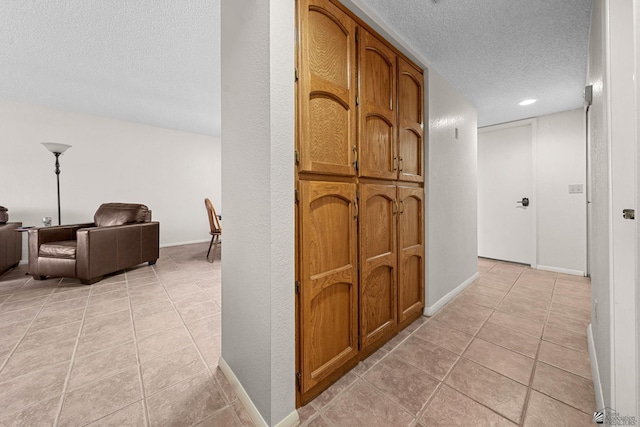 11230 E 37th Pl Unit 131, Yuma, AZ 85367 - hall with a textured ceiling and light tile patterned floors