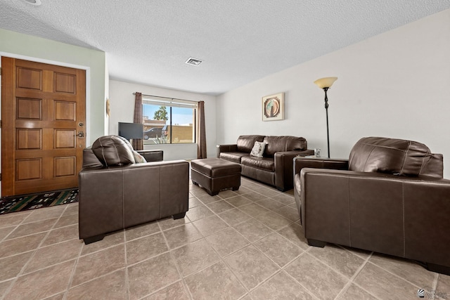 11230 E 37th Pl Unit 131, Yuma, AZ 85367 - living room with a textured ceiling and light tile patterned floors