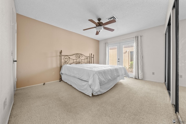 11230 E 37th Pl Unit 131, Yuma, AZ 85367 - carpeted bedroom featuring access to outside, french doors, ceiling fan, and a textured ceiling