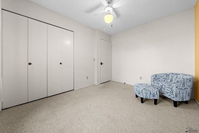 11230 E 37th Pl Unit 131, Yuma, AZ 85367 - sitting room featuring a ceiling fan, carpet flooring, and a textured ceiling