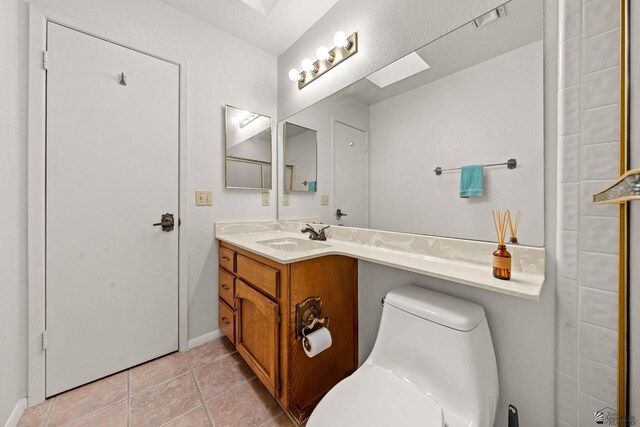 11230 E 37th Pl Unit 131, Yuma, AZ 85367 - bathroom with vanity and tile patterned flooring