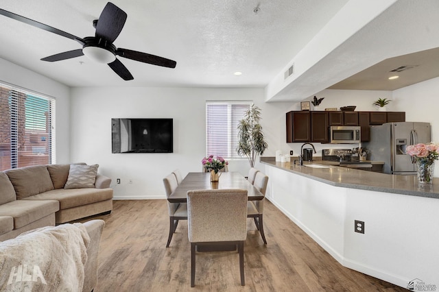 3591 W 22 Street 3591W 22Nd Street, #E, Yuma, AZ 85364 - dining space with baseboards, wood finished floors, and a wealth of natural light