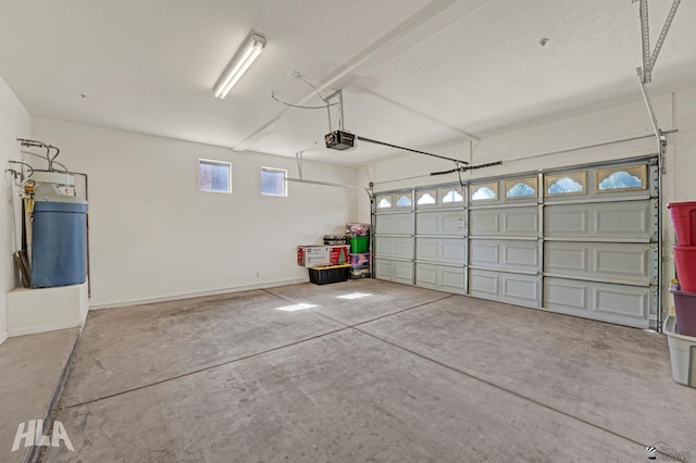 3591 W 22 Street 3591W 22Nd Street, #E, Yuma, AZ 85364 - garage with water heater, baseboards, and a garage door opener