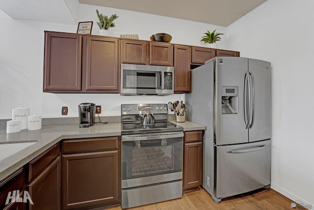 3591 W 22 Street 3591W 22Nd Street, #E, Yuma, AZ 85364 - kitchen featuring light stone countertops, stainless steel appliances, and light wood-type flooring