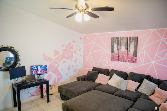 tiled living area with ceiling fan