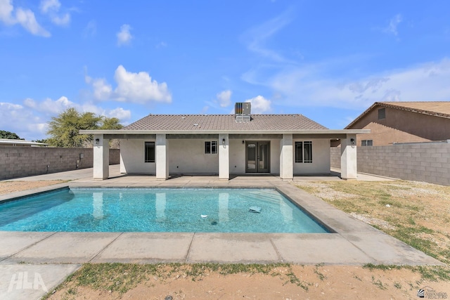 back of house with a patio area, a fenced backyard, a tile roof, and stucco siding