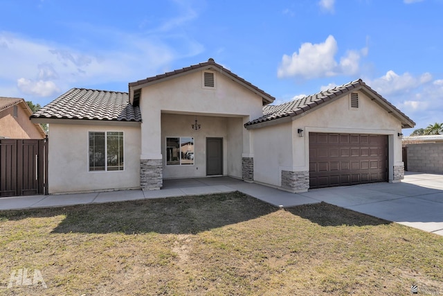 view of front of property featuring a garage, driveway, stone siding, and stucco siding